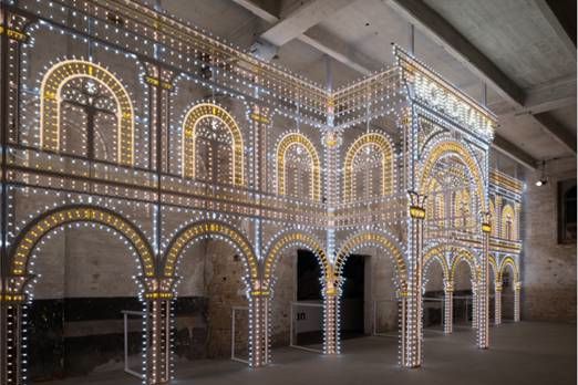 Luminaire is a collaboration between OMA (Rem Koolhaas) and Swarovski. This dazzling 6 x 20-metre archway at the entrance to Monditalia is illuminated with thousands of coloured light bulbs and 15 kilograms of Swarovski Crystal Rocks.
