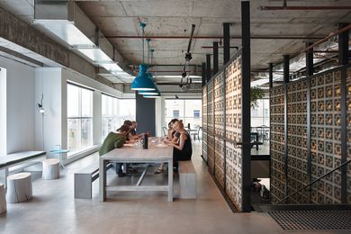 The L-shaped cafe and hub space encourages staff collaboration.