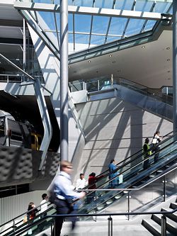 Escalators lead upwards from Victoria Avenue to Railway Street. The interchange channels pedestrians both under and over the rail corridor.