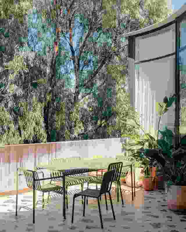 A south-facing balcony borrows its leafy outlook from the neighbouring pocket park.