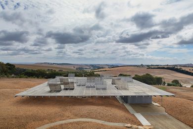 On an undulating Australian landscape, the house introduces a repeated, geometric architectural ordering.