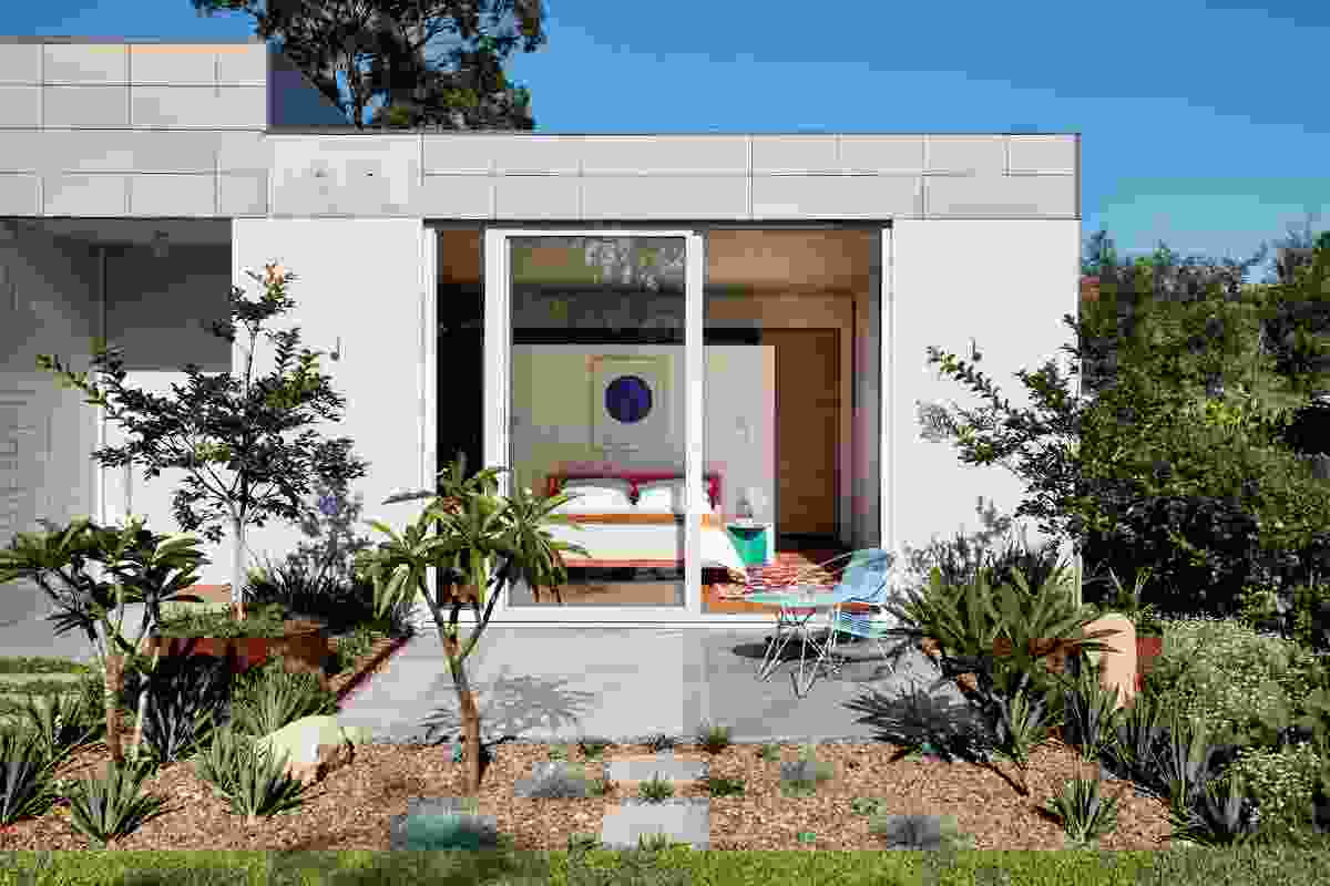 The main bedroom extends onto a garden at the rear. Artwork: Yves Klein. Styling: Alicia Sciberras.