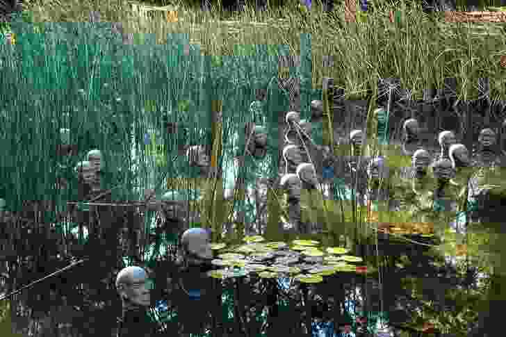 Dadang Christanto’s Heads from the North (2004) in a marsh pond.