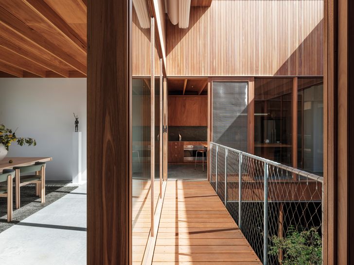First-floor living spaces are arranged around a private garden courtyard.  Sculpture: Raffaella Benetti.