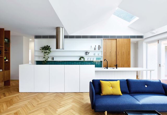 The kitchen island functions as the home’s backbone, around which everyday activities take place.